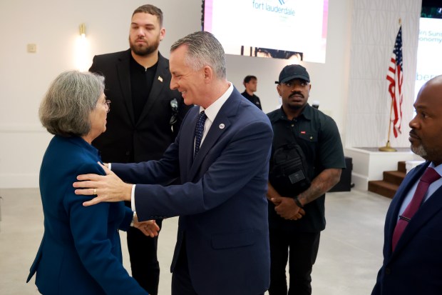 Democratic gubernatorial nominee David Jolly greets Miami-Dade County Mayor Daniella Levine Cava during the Sunshine Economy Summit in Fort Lauderdale on Wednesday, Sept. 23, 2026. (Mike Stocker/South Florida Sun Sentinel)