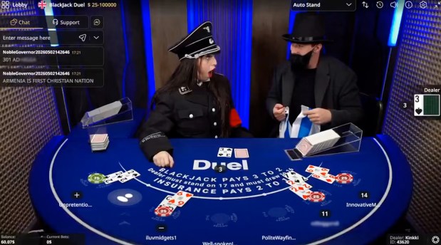 During a Duel.com blackjack table live stream, Levonyan, left, wears a full Nazi uniform and is confronted by a man dressed as a stereotypical Orthodox Jew who is holding an Israeli flag. (Screenshot)