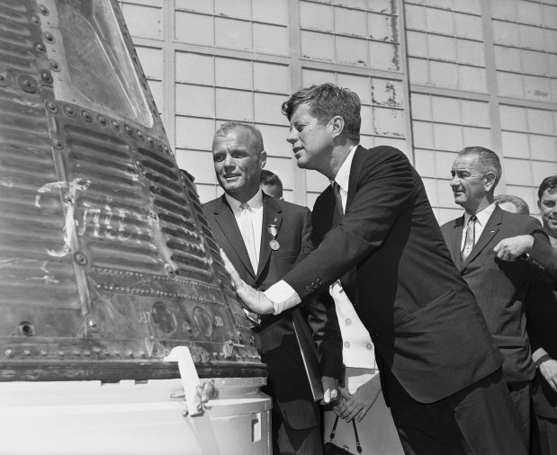 FIRST IN ORBITAstronaut John Glenn and President John F. Kennedy inspect the Friendship 7, the Mercury capsule in which Glenn became the first American to orbit the Earth in 1962. (Vincent P. Connolly/AP file)