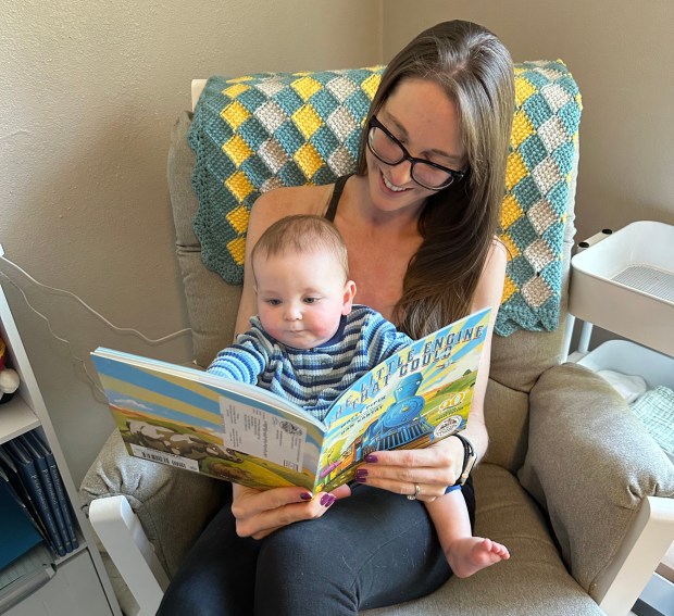 Lauren McCool reads a book her son Connor was gifted from Dolly Parton's Imagination Library. (Provided by family)