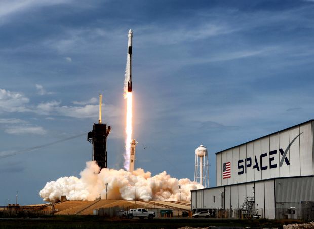 A SpaceX Falcon 9 rocket carrying NASA astronauts Doug Hurley and Bob Behnken in the Crew Dragon Endeavour lifts off from Kennedy Space Center on May 30, 2020, marking the return of human spaceflight to the Space Coast nearly nine years after the end of the Space Shuttle Program. (Joe Burbank/Orlando Sentinel file)