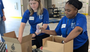 Leon County employees pack food for veterans at Second Harvest of the Big Bend