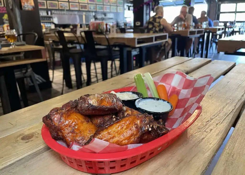 A basket of chicken wings on a table