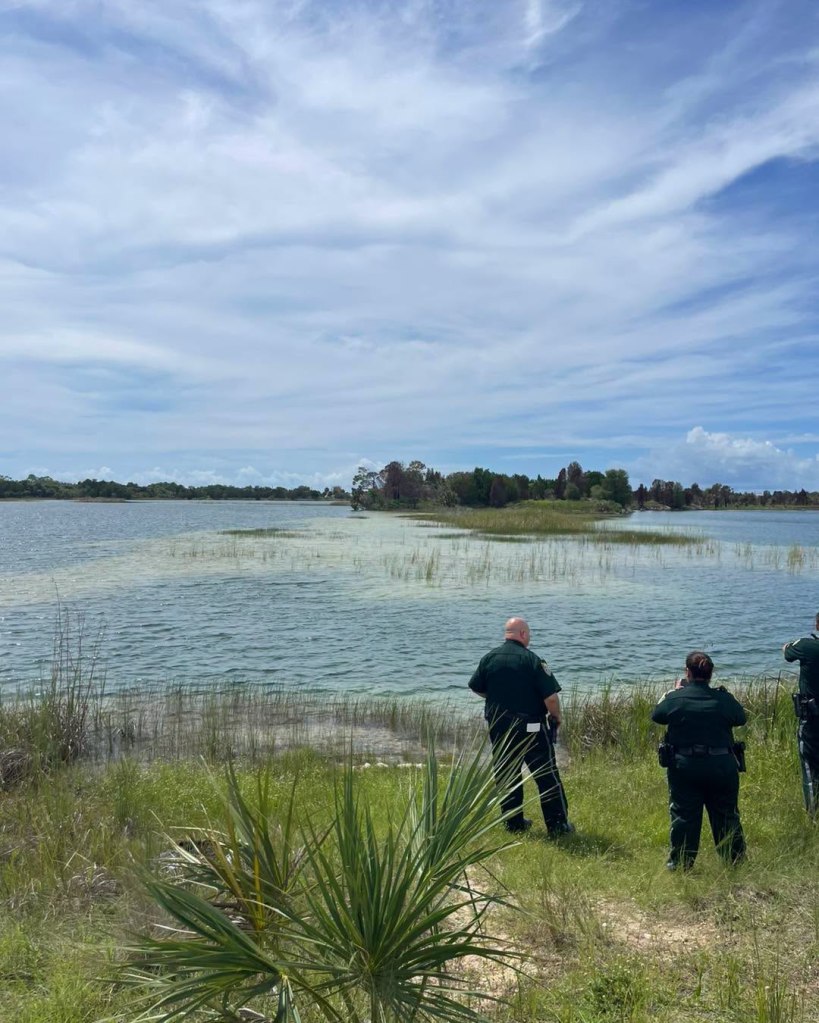 Law enforcement officers overlooking the Weeki Wachee Preserve.