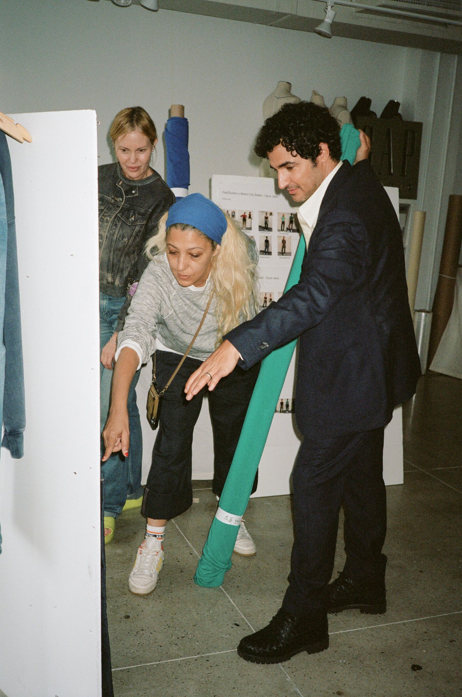 Image may contain Zac Posen Clothing Pants Coat Jacket Blazer Face Head Person Photography Portrait and Footwear