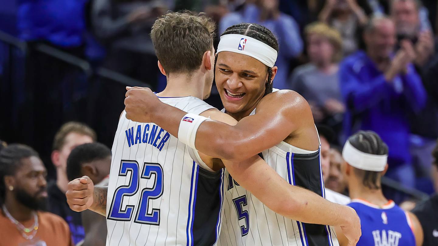 Dec 29, 2023; Orlando, Florida, USA; Orlando Magic forward Franz Wagner (22) and forward Paolo Banchero (5) celebrate their 117-108 win against the New York Knicks at KIA Center. Mandatory Credit: Mike Watters-USA TODAY Sports