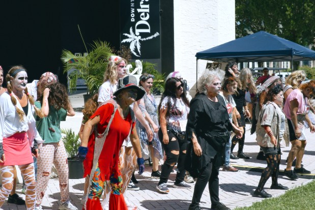 The Delray Zombies perform Michael Jackson's "Thriller" dance at the Coco Market in Delray Beach. They will pop up at various venues during October.
