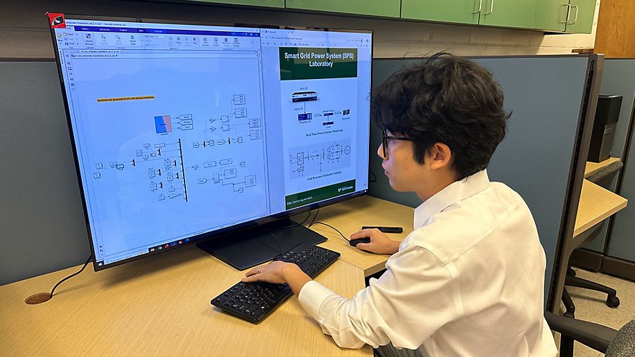 A USF researcher works with a digital simulation of Tampa Electric's power grid as part of a $3.8 million project aimed at improving reliability and detecting potential problems before they lead to outages. (Spectrum News)
