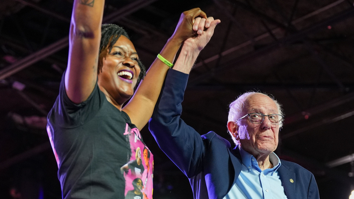 Angie Nixon, left, stands hand in hand with US Sen. Bernie Sanders during a campaign stop in Tallahassee, Florida on Sunday, Oct. 18, 2026.