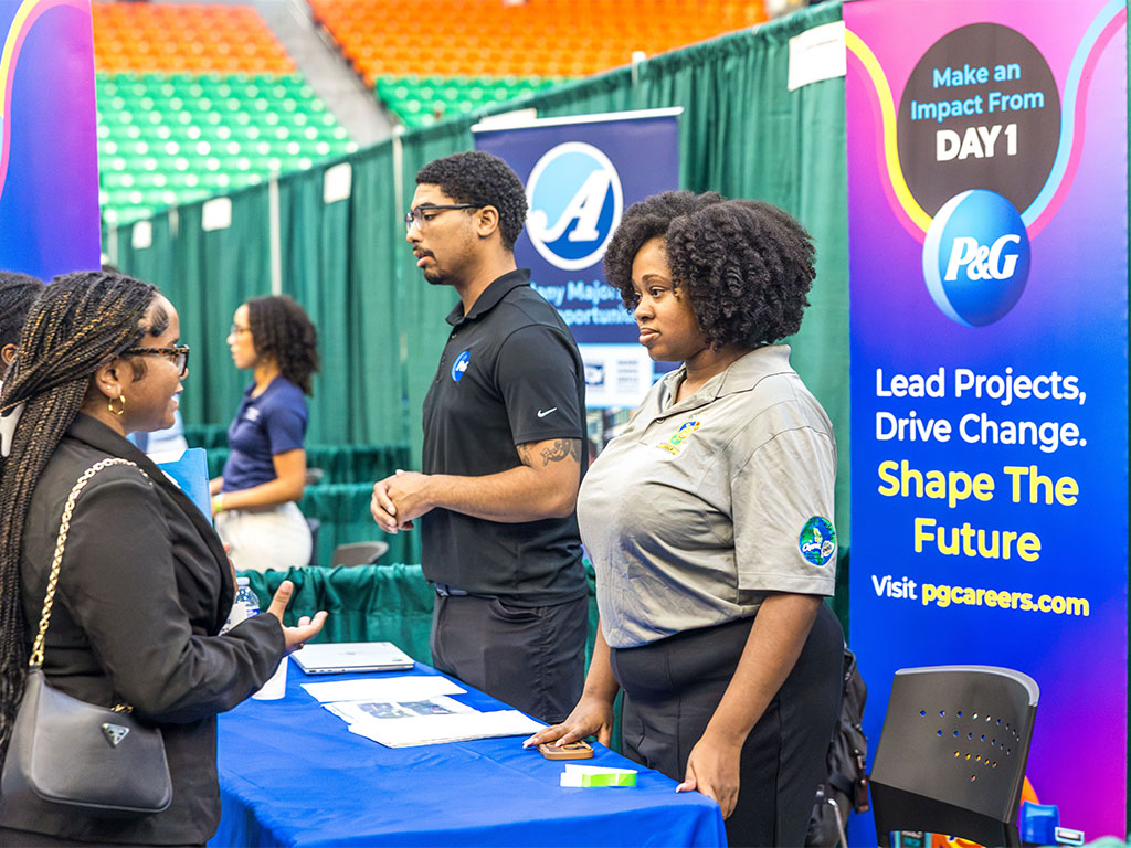 A Florida A&M University student speaks with representatives from Procter & Gamble (P&G) about career opportunities during the Fall 2026 Career and Internship Expo. The event brought together students and employers from a variety of industries. (Photo courtesy of Jeff Adams.)