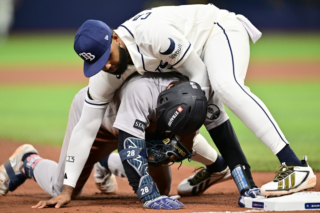 Junior Caminero of the Tampa Bay Rays tags out Austin Wells of the New York Yankees at third base during the eighth inning in game one of the American League Division Series at Tropicana Field in St. Petersburg, Florida, Saturday, October 3, 2026.