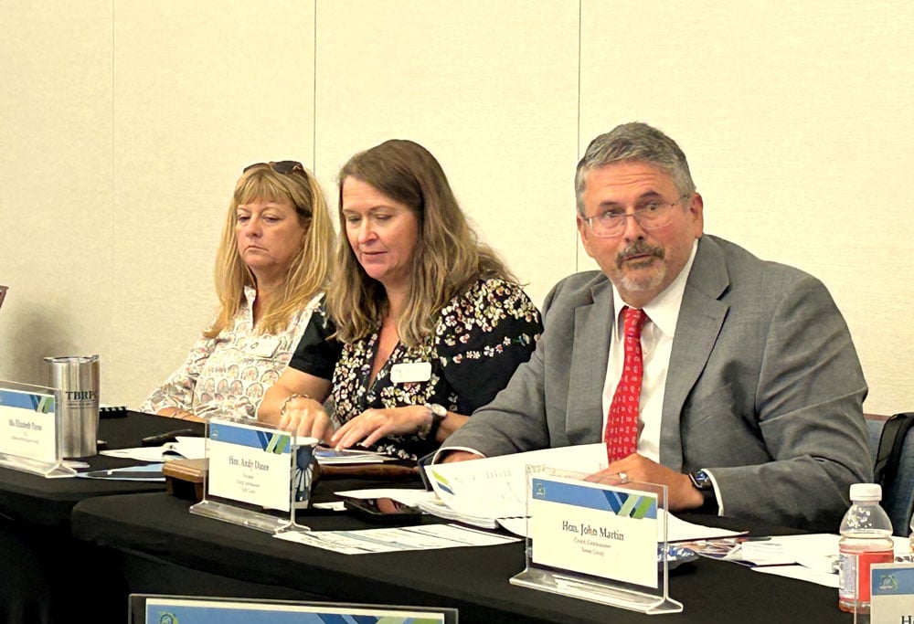 Flagler County District 1 Commissioner Andy Dance, right, was newly installed as the Northeast Florida Regional Council’s President during the organization’s board of directors meeting on Thursday, Oct. 1 at the Nexus Center in Bunnell. Far left is NEFRC Secretary/Treasurer and Clay County Commissioner Betsy Condon, and at center is Beth Payne, NEFRC’s Chief Executive Officer. FlaglerLive photo