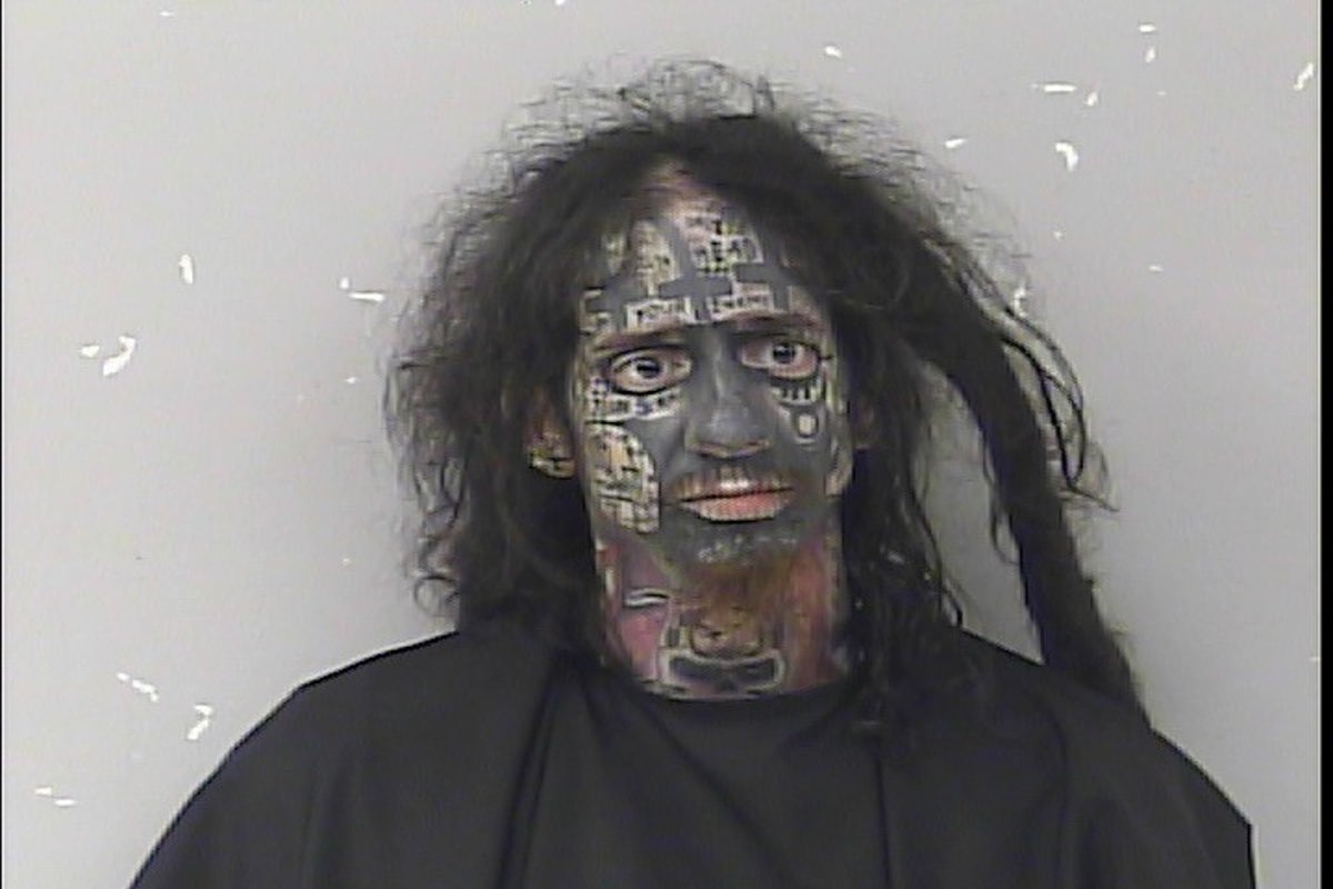 Bizarre mugshot shows ‘demonologist’ accused of tracking women by their phones