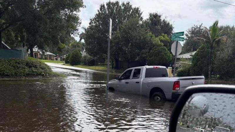 Several Port St. Lucie intersections are experiencing flooding Tuesday evening, with some cars partially submerged as water builds up on area roadways. (SLCScanner)