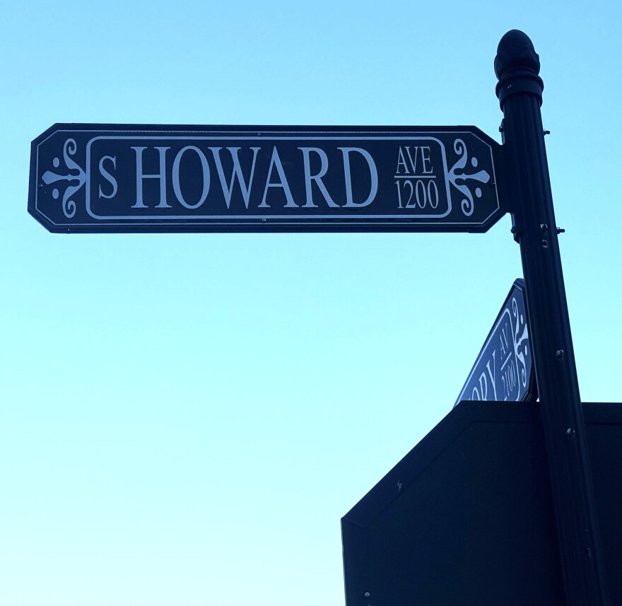 closeup of a green street sign that says S HOWARD AVE on the 1200 block 