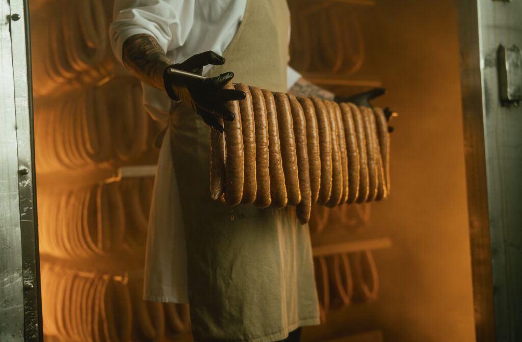 A person in the smokehouse for Uncle John's Pride