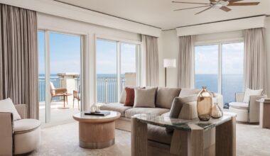 Suite designs lean on organic materials and the sea-and-sand palette beyond the massive-scale windows. Photo courtesy of The Ritz-Carlton Key Biscayne, Miami