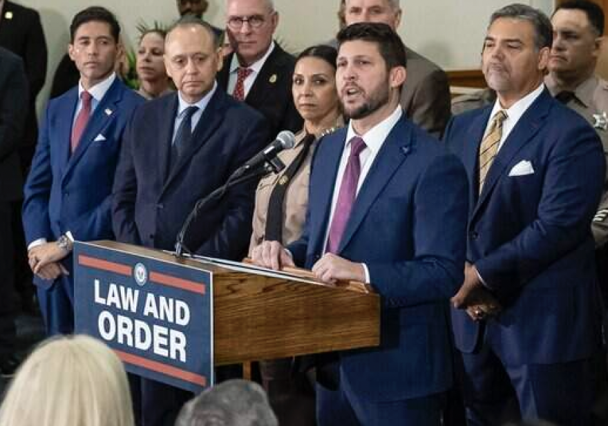 Florida Attorney General James Uthmeier (at microphone) announcing a state indictment against former Cuban leader Raul Castro, at Florida International University in Miami, on Monday, October 19, 2026.