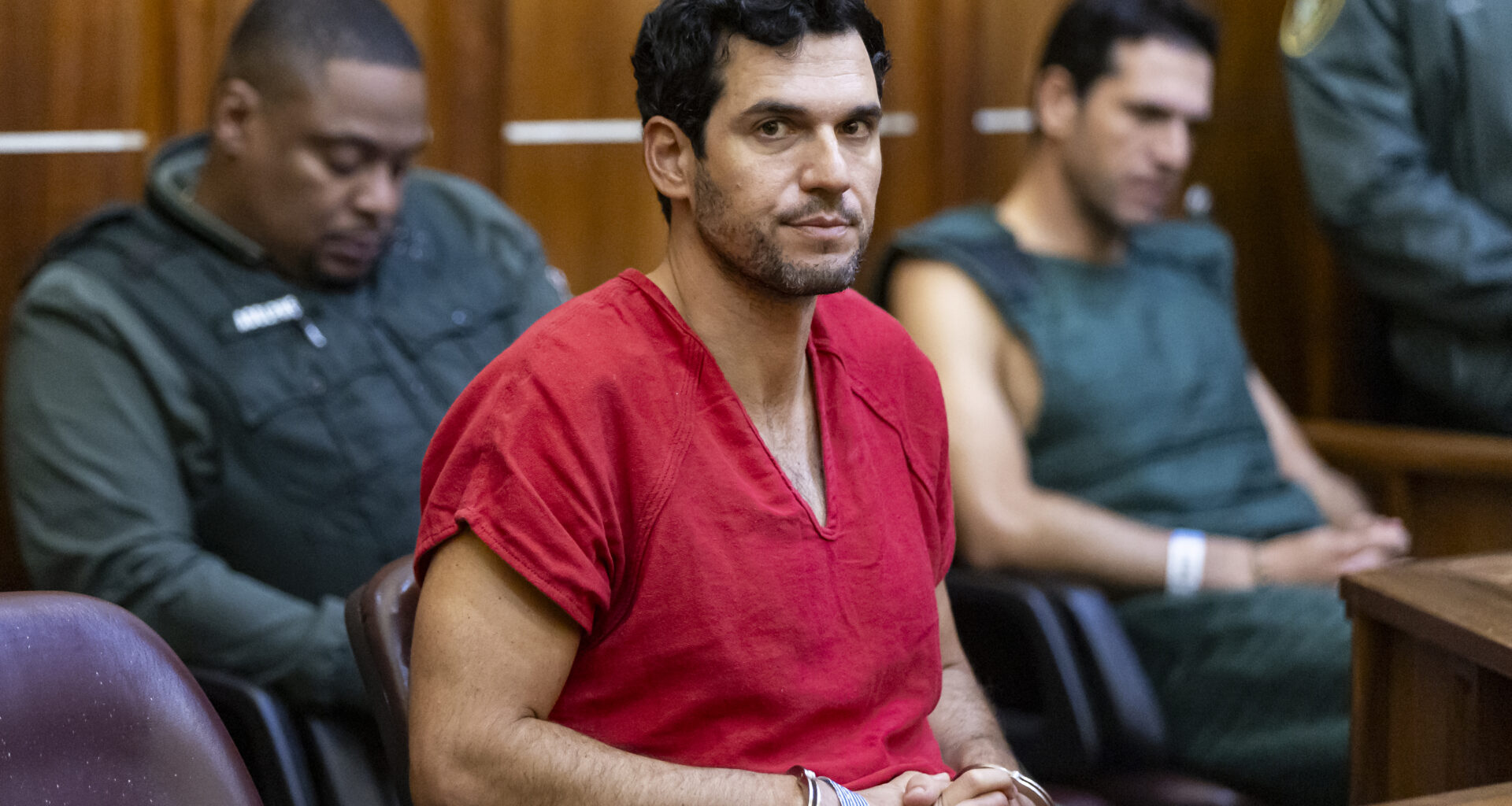 Oren Alexander, 37, center, and his twin brother, Alon, right, attend their bond hearing at the Richard E. Gerstein Justice Building on December 13, 2024 in Miami, Florida. The Alexanders have been charged with multiple state and federal crimes, including sex trafficking and rape.