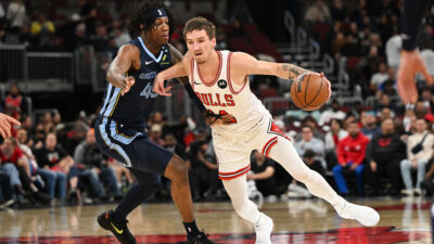 Oct 9, 2026; Chicago, Illinois, USA; Chicago Bulls forward Matas Buzelis (14) moves the ball against Memphis Grizzlies forward GG Jackson (45) during the first half at United Center.