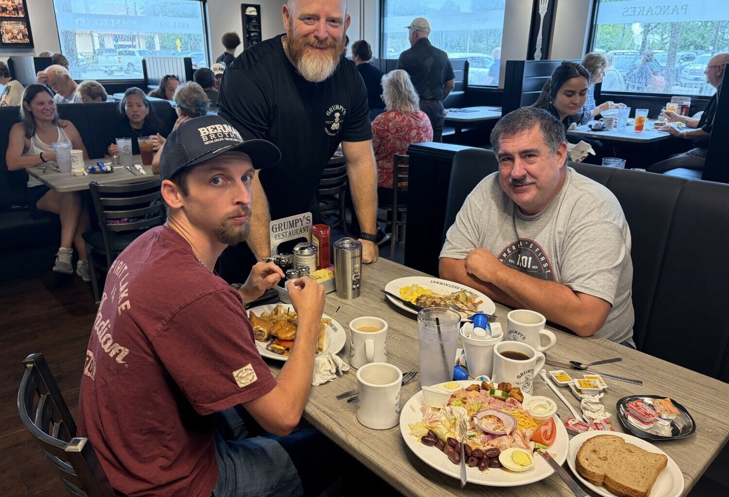 Owner Dell Hoard Jr. checks with hungry customers to make sure everything all right during Grumpy