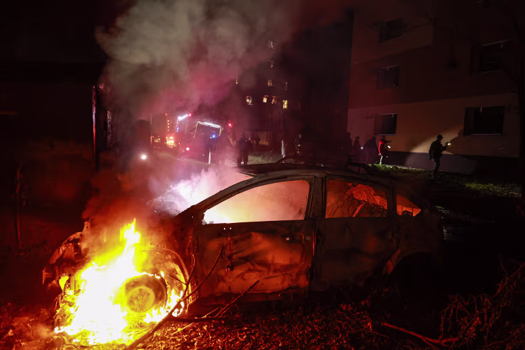 Image: A burning damaged car