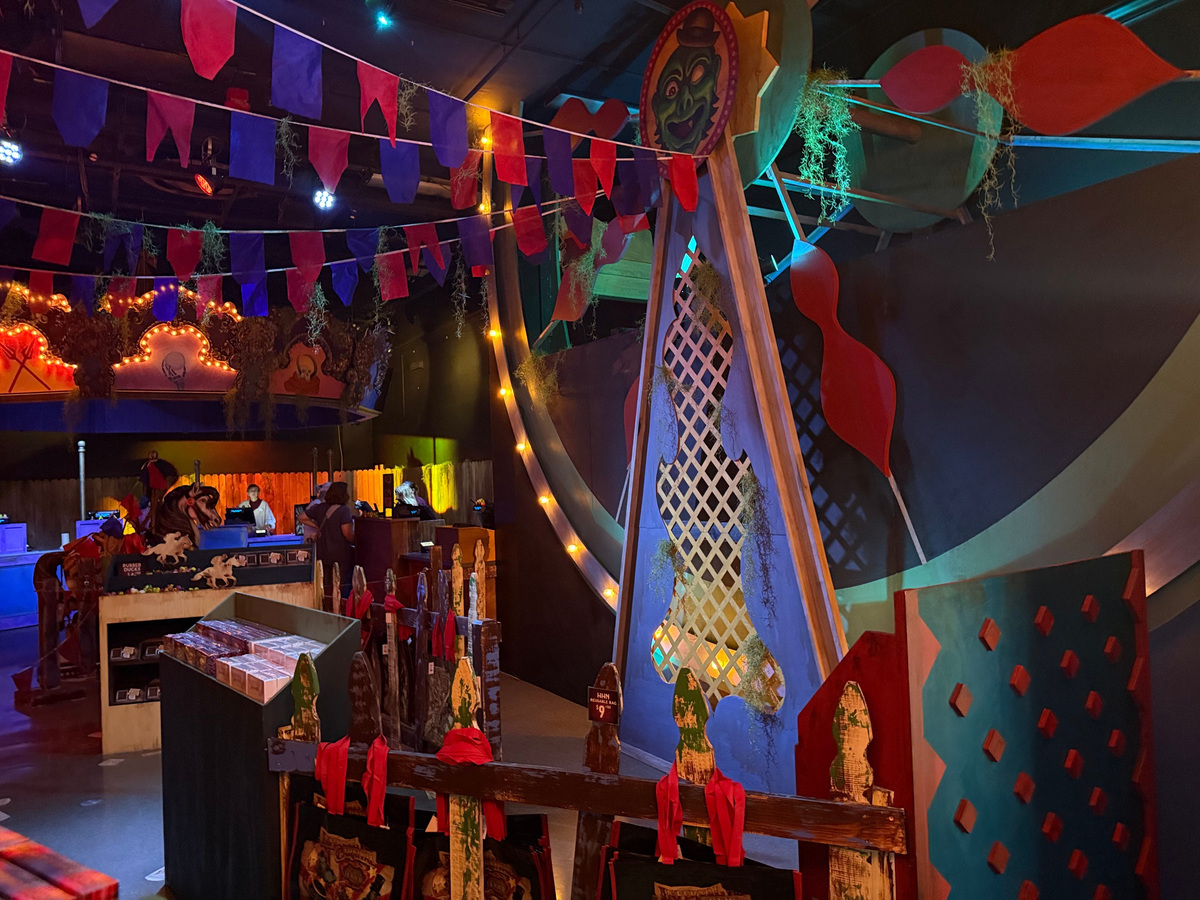 A huge ferris wheel and carousel fill a room in the Tribute Store during Universal Orlando's Halloween Horror Nights.