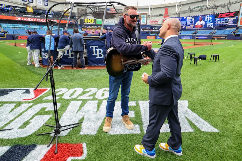 ST. PETERSBURG, FL - APRIL 06: Eric Church greets Chief Executive Officer Ken Babby of the Tampa Bay Rays during national anthem rehearsal prior to the game between the Chicago Cubs and the Tampa Bay Rays at Tropicana Field on Monday, April 6, 2026 in St. Petersburg, Florida. (Photo by Mike Carlson/MLB Photos via Getty Images)