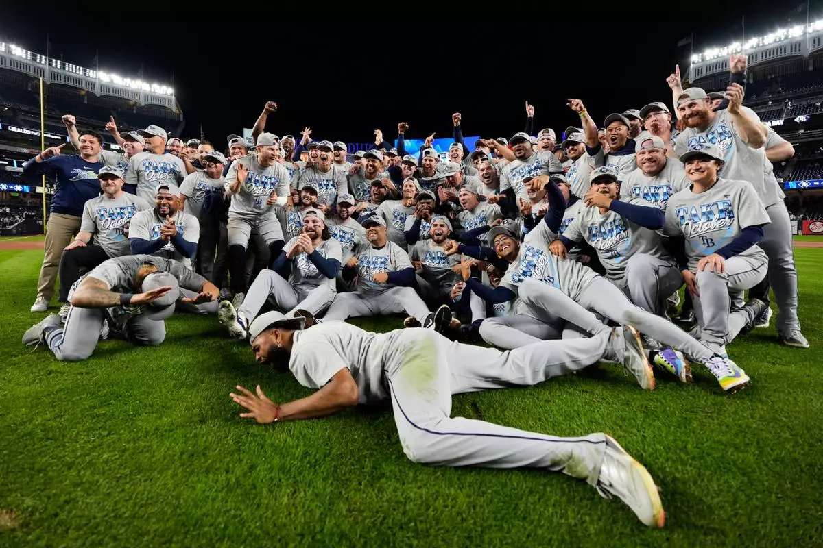 The Tampa Bay Rays celebrate the team's win in Game 3 of baseball's American League Division Series against the New York Yankees, Wednesday, Oct. 7, 2026, in New York. (AP Photo/Yuki Iwamura)