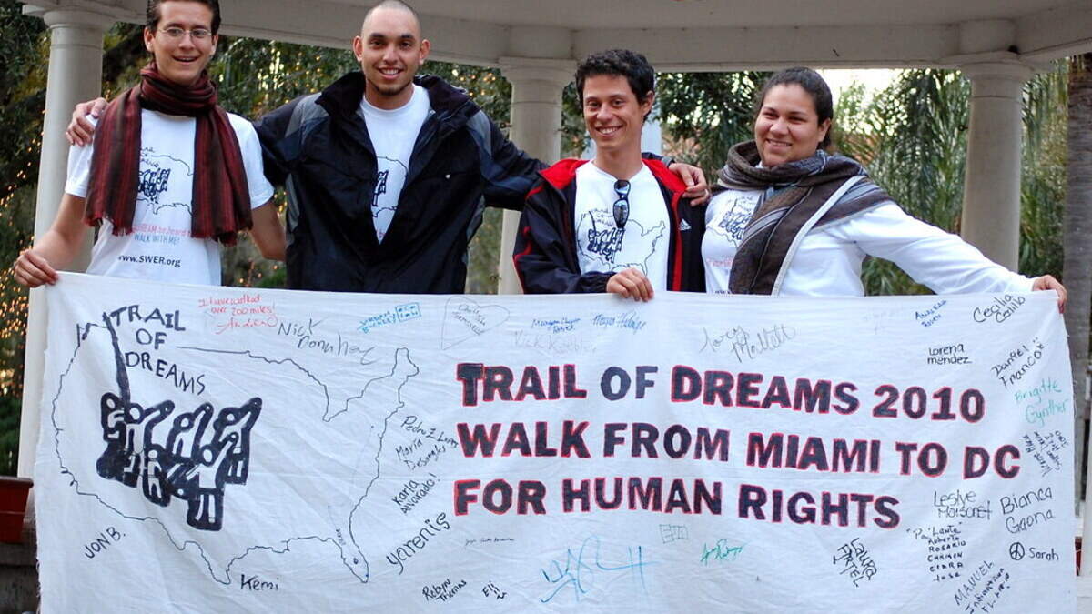 Walking With A Purpose: Pictured from left to right are Juan Rodriguez (now Isabel Sousa), Carlos Roa, Felipe Sousa-Lazaballet, and Maria Gabriela “Gaby” Pacheco during one of the group’s 42 stops during the 1,500-mile Trail of Dreams march. PHOTO COURTESY OF THE TRAIL OF DREAMS WEBSITE Walking With A Purpose: Pictured from left to right are Juan Rodriguez (now Isabel Sousa), Carlos Roa, Felipe Sousa-Lazaballet, and Maria Gabriela “Gaby” Pacheco during one of the group’s 42 stops during the 1,500-mile Trail of Dreams march. PHOTO COURTESY OF THE TRAIL OF DREAMS WEBSITE