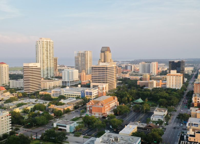 Aerial view of the downtown St. Petersburg, Florida skyline and waterfront buildings during the day.