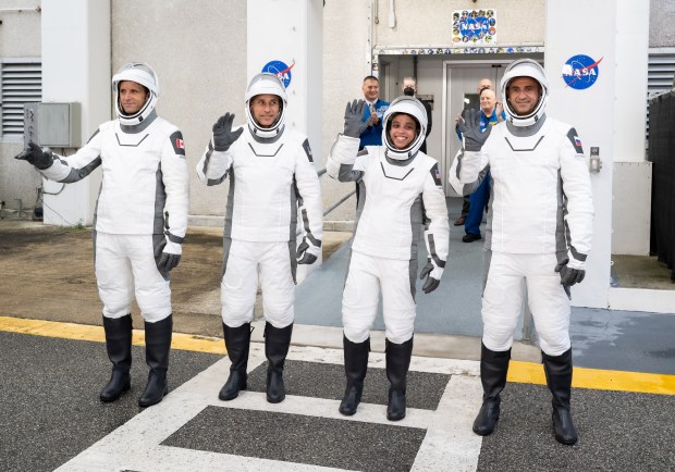 Canadian Space Agency astronaut Joshua Kutryk, left, NASA astronauts Luke Delaney and Jessica Watkins, and Roscosmos cosmonaut Sergey Teteryatnikov, wearing prepare to depart the Neil A. Armstrong Operations and Checkout Building for Space Launch Complex 40 on Cape Canaveral Space Force Station to board the SpaceX Dragon spacecraft for the Crew-13 mission launch, Thursday, Oct. 1, 2026, at NASA's Kennedy Space Center (Joel Kowsky/NASA)