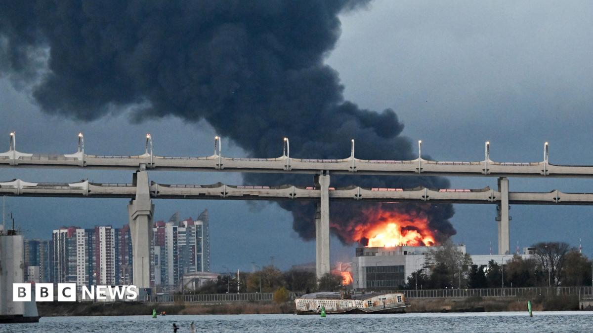 Flames emerge and smoke rises from St Petersburg's oil terminal following an aerial attack there on 18 October, 2026