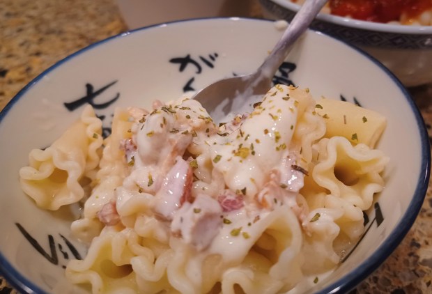 The signature CupPasta sauce, creamy and loaded with bacon, is the most popular. Red pepper flake is a nice add-in if you take it home to prepare yourself. Grated Locatelli, too. (Amy Drew Thompson/Orlando Sentinel)
