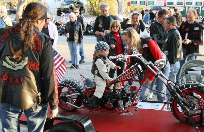 Dylan Baker, 2, of Cape Coral, sits on a miniature chopper during Cape Coral Bike Night on Saturday, February 7, 2009.
