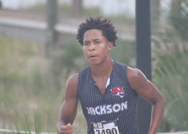 Jackson's Tracy Pratt (3490) runs to the line in third in the boys race during the Nor'Eastern Classic high school cross country meet on Sept. 29, 2026 in Jacksonville Beach, Florida. [Clayton Freeman/Florida Times-Union]