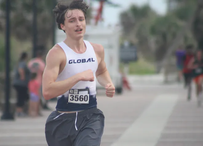 Global Academy's Adam Guerrieri (3560) runs in the boys race during the Nor'Eastern Classic high school cross country meet on Sept. 29, 2026 in Jacksonville Beach, Florida. [Clayton Freeman/Florida Times-Union]