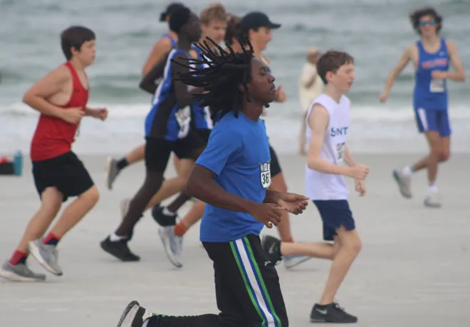 Runners race along the beach at the start of the Nor'Eastern Classic high school cross country meet on Sept. 29, 2026 in Jacksonville Beach, Florida. [Clayton Freeman/Florida Times-Union]
