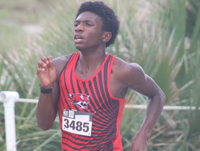 Jackson's Dominique Ghee (3485) runs to the line in second during the Nor'Eastern Classic high school cross country meet on Sept. 29, 2026 in Jacksonville Beach, Florida. [Clayton Freeman/Florida Times-Union]
