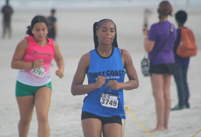 First Coast's Indya Lewis (3749) runs in the girls race during the Nor'Eastern Classic high school cross country meet on Sept. 29, 2026 in Jacksonville Beach, Florida. [Clayton Freeman/Florida Times-Union]