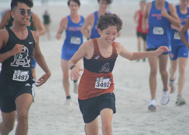 Atlantic Coast's Amir Kayati (3497) and Bradley Cushnir (3492) run in the boys race during the Nor'Eastern Classic high school cross country meet on Sept. 29, 2026 in Jacksonville Beach, Florida. [Clayton Freeman/Florida Times-Union]