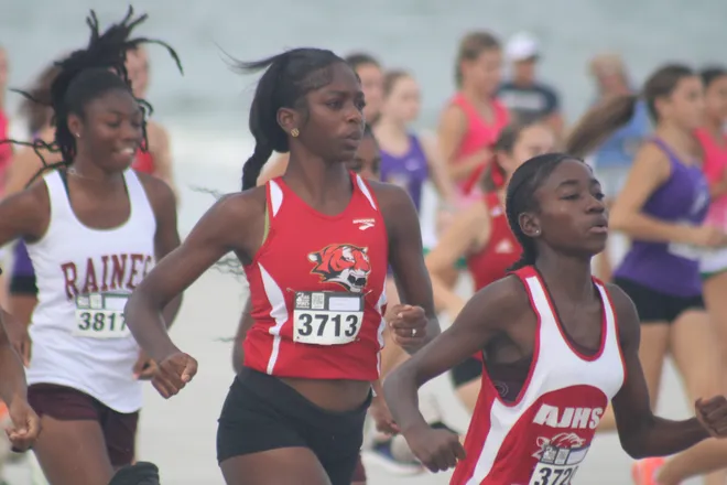 Jackson's Samari Barrington (3713) and Sanyia Randolph (3720) and Raines' Maleah Smothers (3817) start during the Nor'Eastern Classic high school cross country meet on Sept. 29, 2026 in Jacksonville Beach, Florida. [Clayton Freeman/Florida Times-Union]
