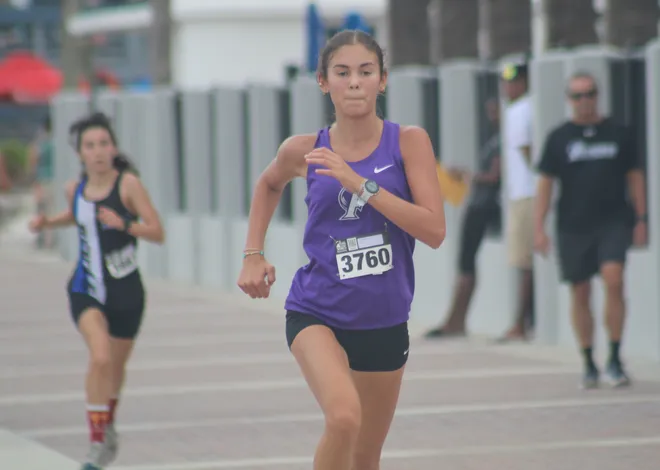 Fletcher's Madison Heck (3760) runs to the girls finish in second during the Nor'Eastern Classic high school cross country meet on Sept. 29, 2026 in Jacksonville Beach, Florida. [Clayton Freeman/Florida Times-Union]