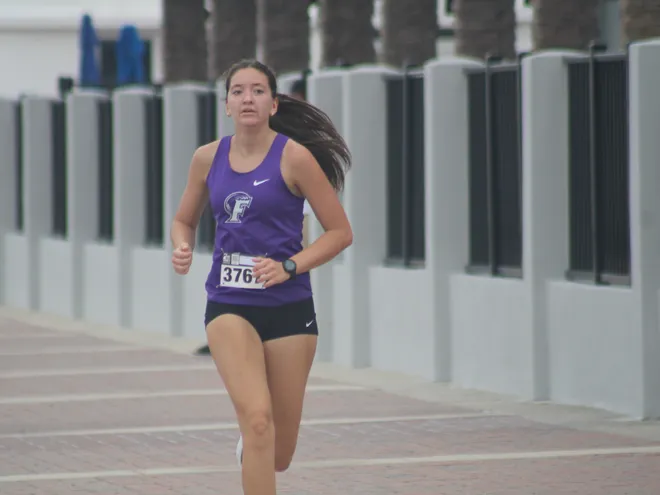 Fletcher's Clara Murillo (3767) races to the girls finish in fifth during the Nor'Eastern Classic high school cross country meet on Sept. 29, 2026 in Jacksonville Beach, Florida. [Clayton Freeman/Florida Times-Union]