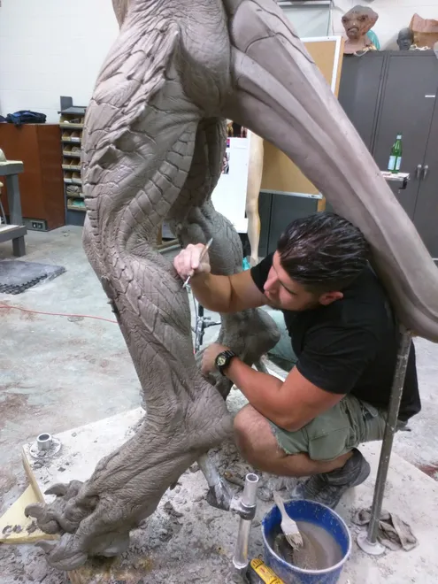 Wayne Anderson hard at work in Hollywood sculpting a monster out of clay.