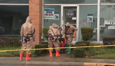A hazmat crew investigates at Rep. Maxwell Frost's office. (Spectrum News)