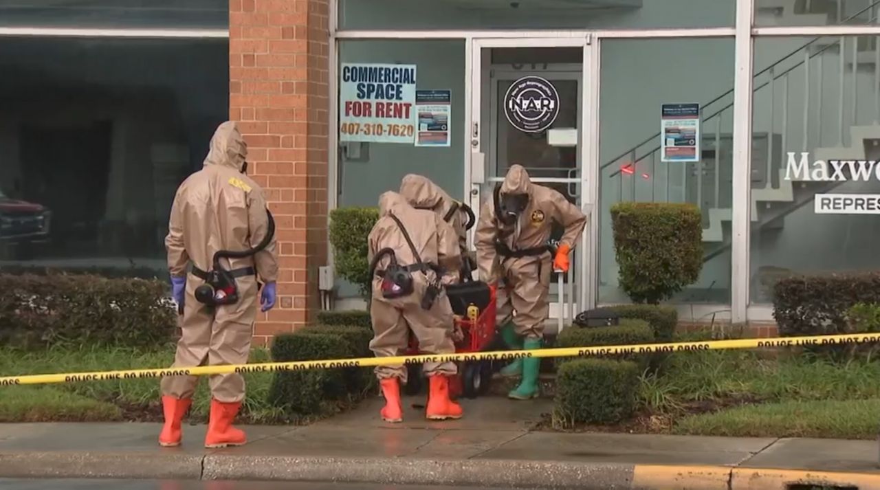 A hazmat crew investigates at Rep. Maxwell Frost's office. (Spectrum News)