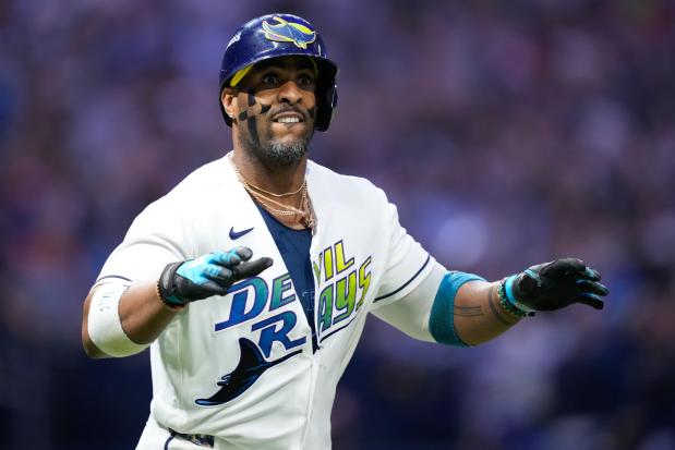 Rays' Yandy Díaz celebrates his two-run home run against the Guardians during the eighth inning in Game 6 of an American League Championship Series game in St. Petersburg, Fla., on Oct. 19, 2026. (AP Photo/David J. Phillip)