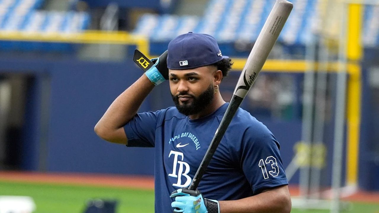 Tampa Bay Rays' Junior Caminero walks to the batting cage during a Sunday practice at Tropicana Field before the American League Championship Series against the Cleveland Guardians begins on Monday, Oct. 12. (AP Photo/Chris O'Meara)