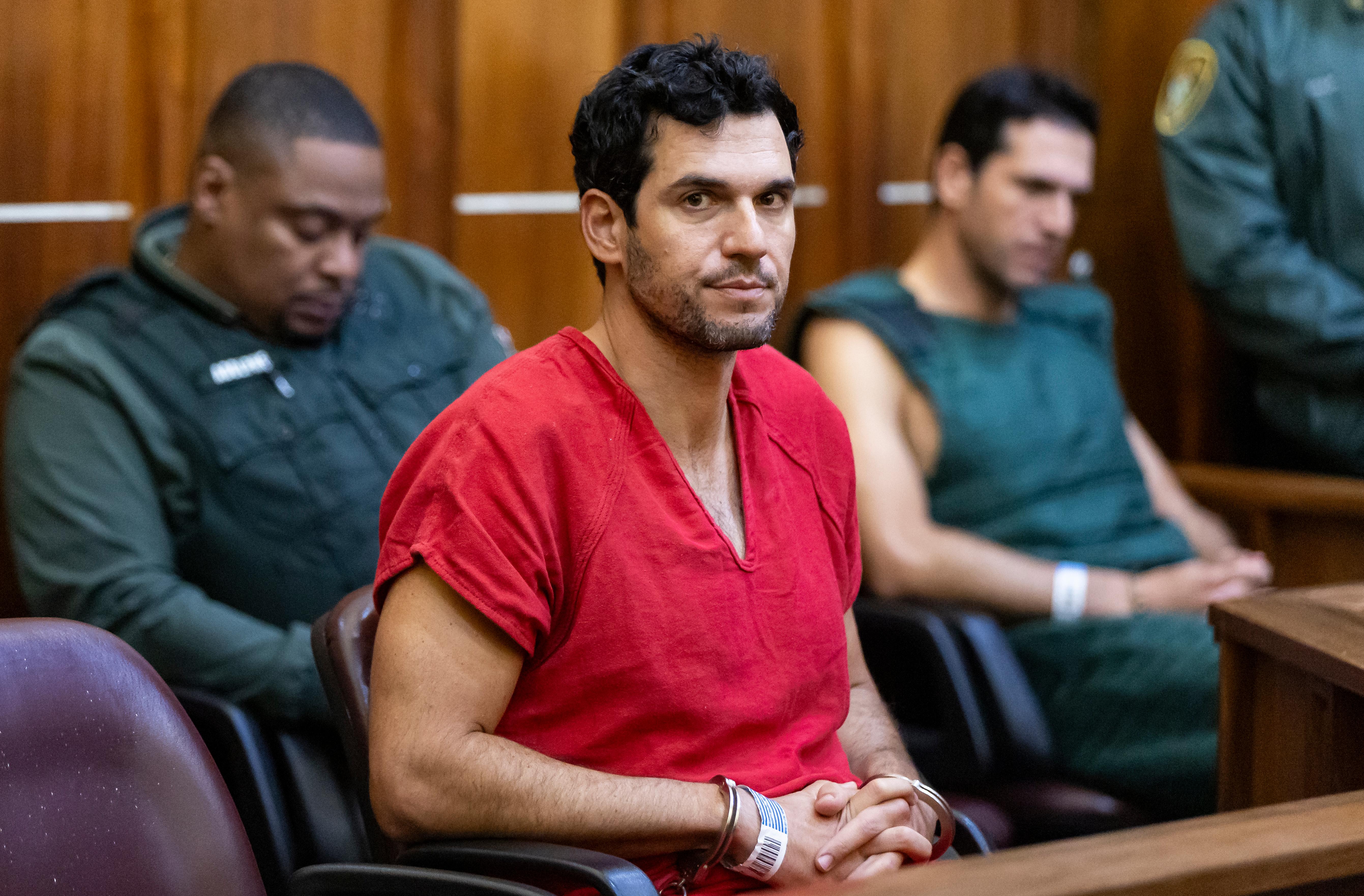 Oren Alexander, 37, center, and his twin brother, Alon, right, attend their bond hearing at the Richard E. Gerstein Justice Building on December 13, 2024 in Miami, Florida. The Alexanders have been charged with multiple state and federal crimes, including sex trafficking and rape.